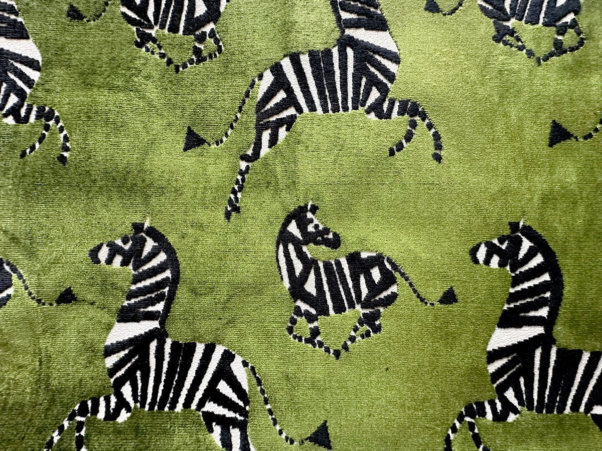 Green Velvet Zebra Fabric: Elegant green velvet fabric featuring a striking zebra pattern, ideal for creating statement pieces in home decor and upscale upholstery projects. Adds a touch of sophistication and bold design to any interior