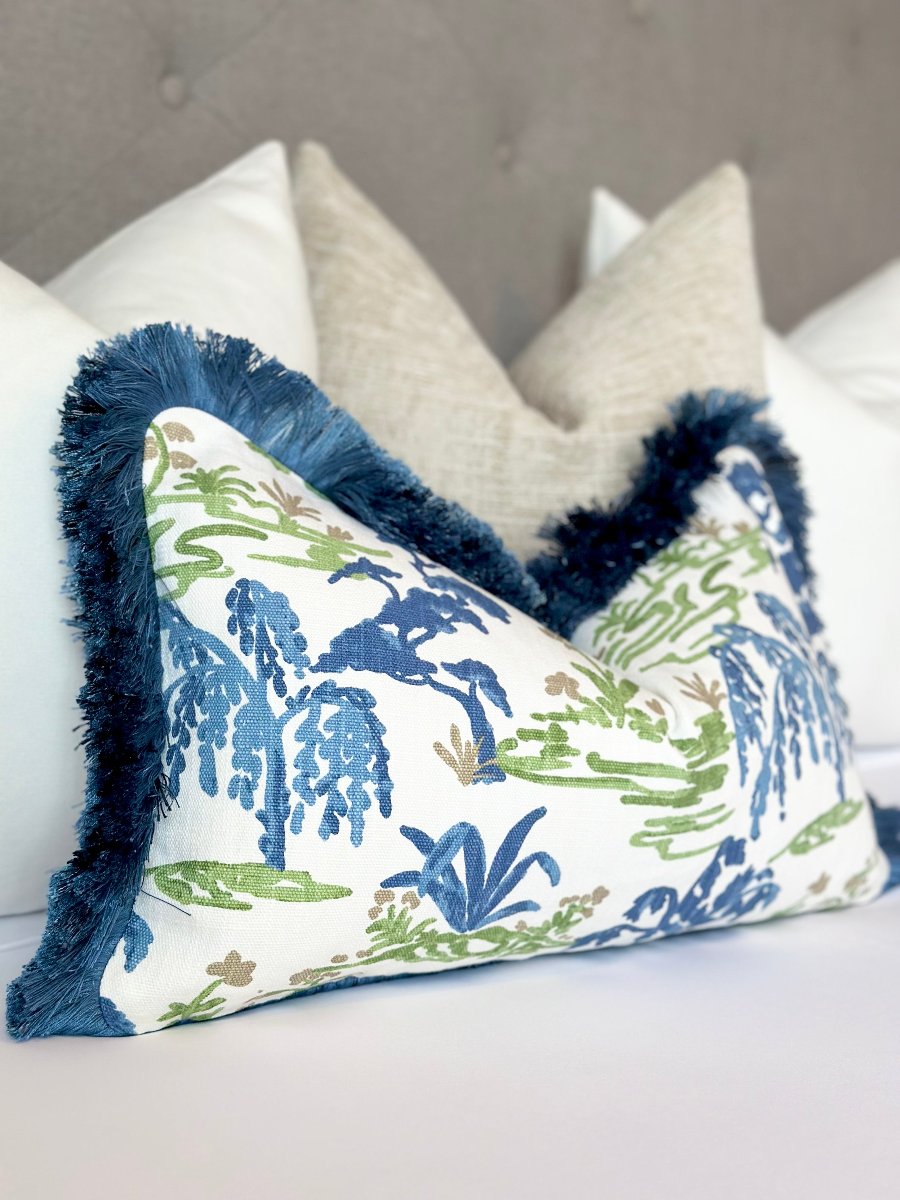 Meadow throw pillow cover with navy blue brushed fringe, made from high-quality fabric to add a stylish and vibrant accent to your home decor