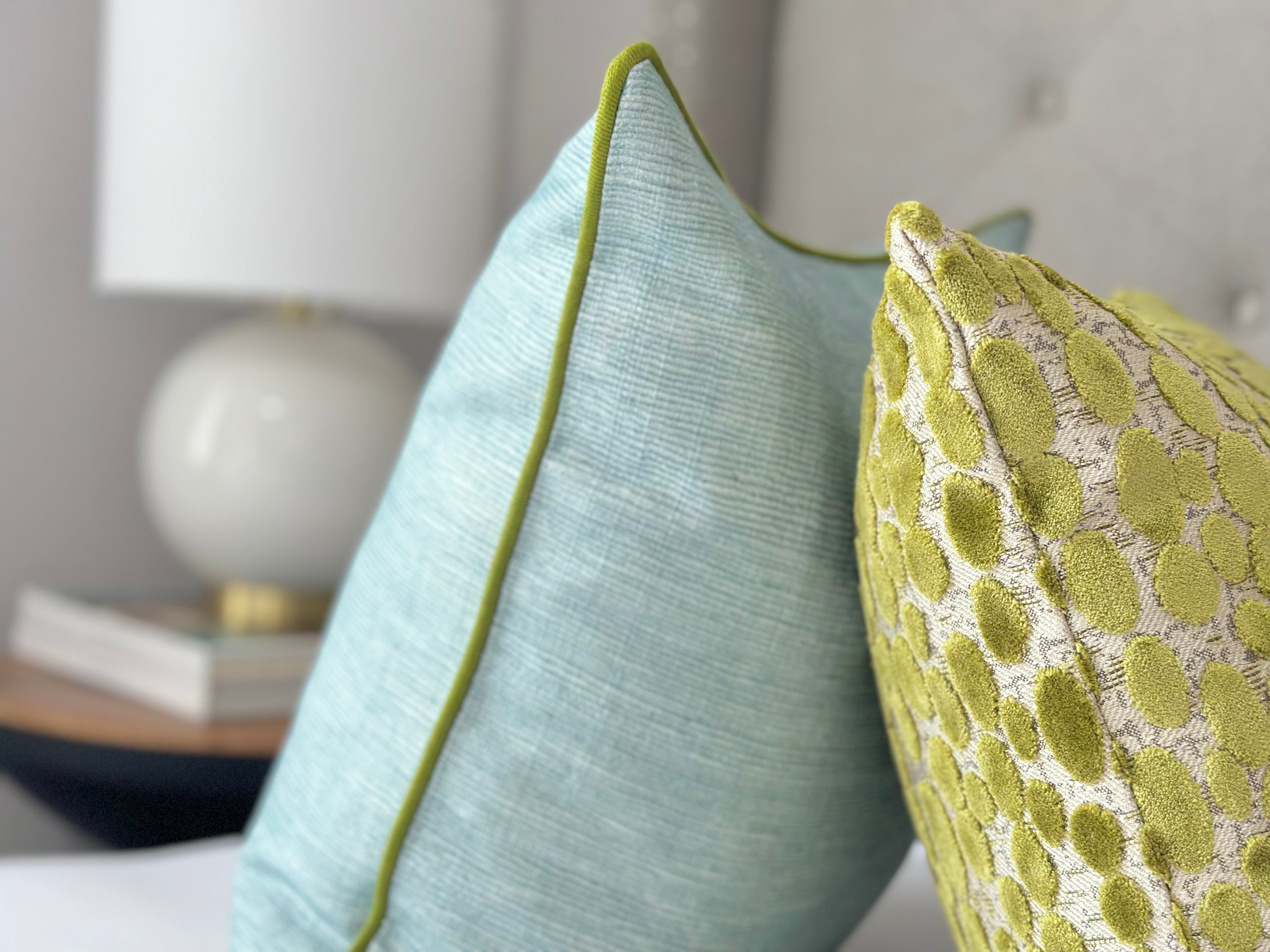 Custom-made seaglass pillow cover with vibrant green trim for stylish home interiors, designed for those seeking unique coastal and modern design elements