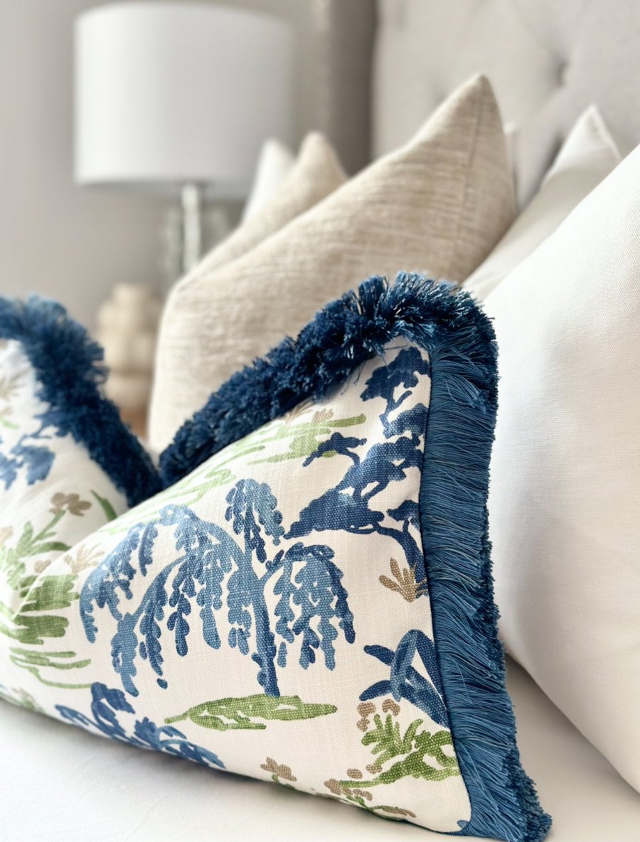 Custom meadow print throw pillow cover featuring navy blue brushed fringe detail, crafted from premium materials for a chic and sophisticated look.