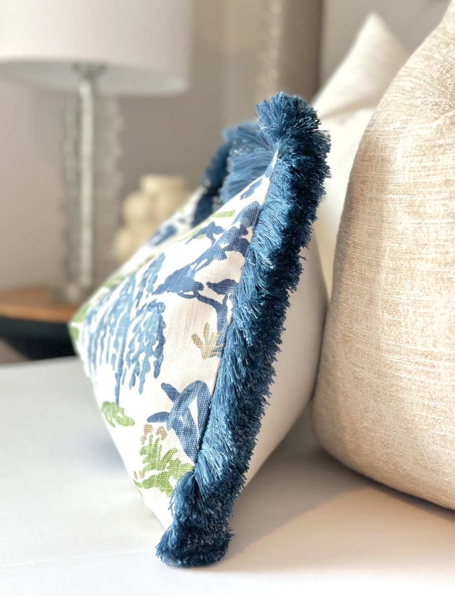 High-quality meadow throw pillow cover with plush navy blue brushed fringe, designed to bring a touch of elegance and charm to any living space.