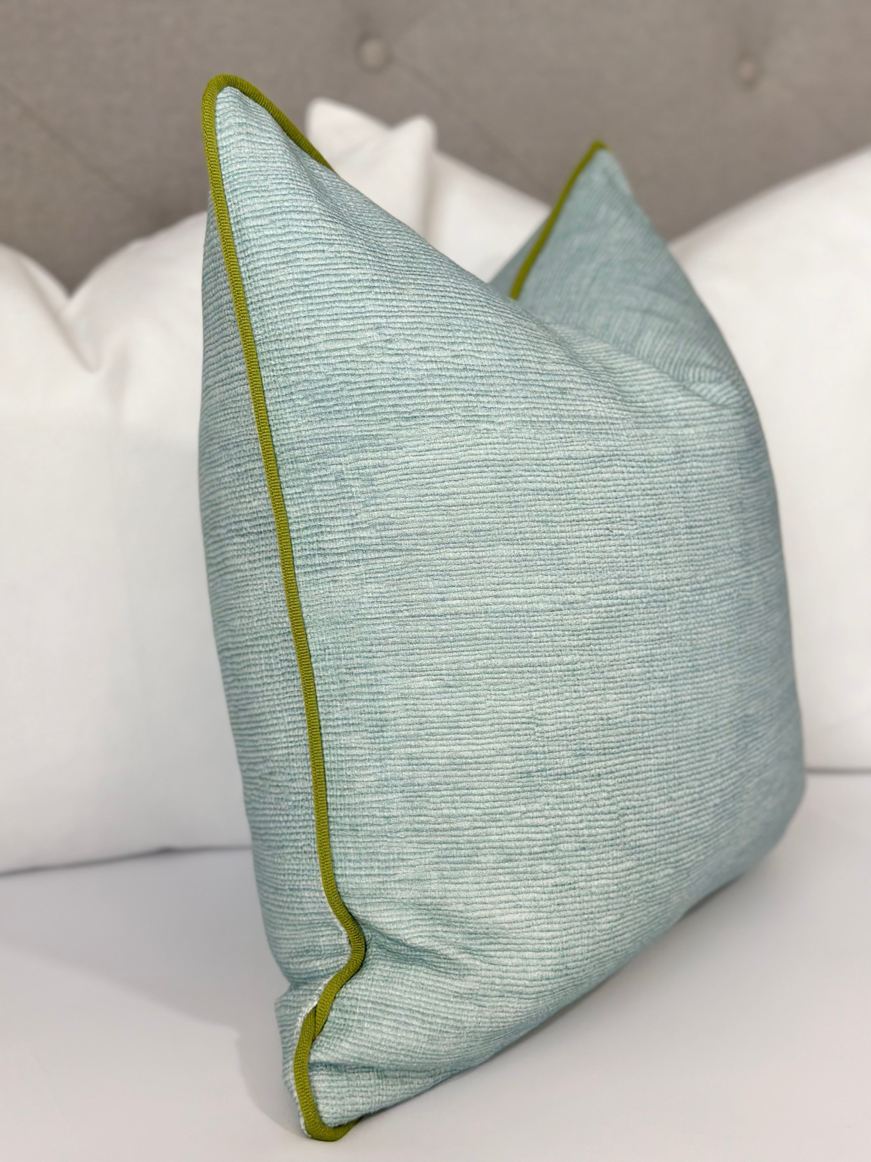 Seaglass pillow cover with green trim detail, perfect for coastal and modern decor, adding a refreshing touch to living rooms, bedrooms, and home interiors