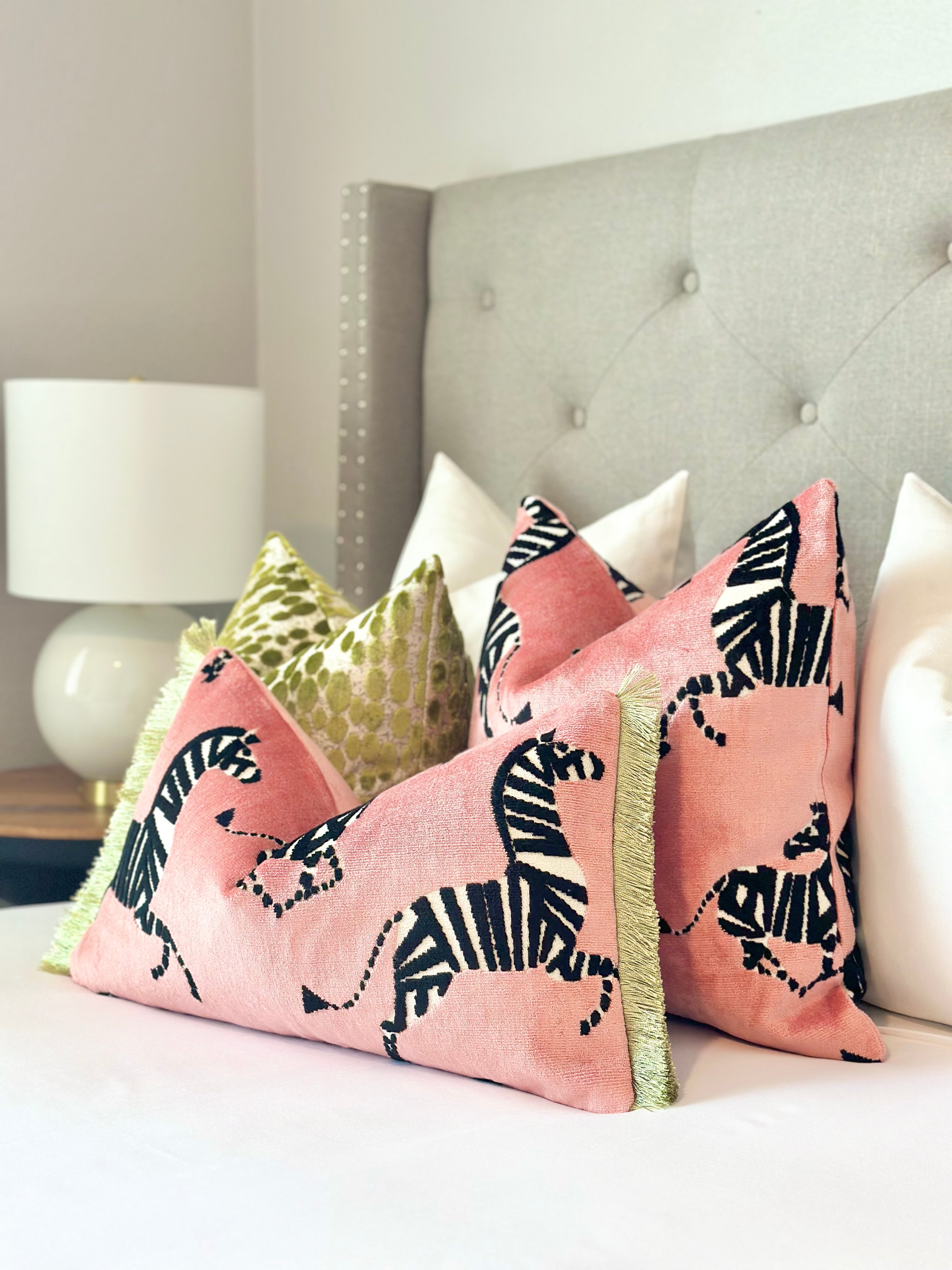 Luxurious pink velvet throw pillow cover with bold zebra print, perfect for adding a touch of modern elegance to your home decor
