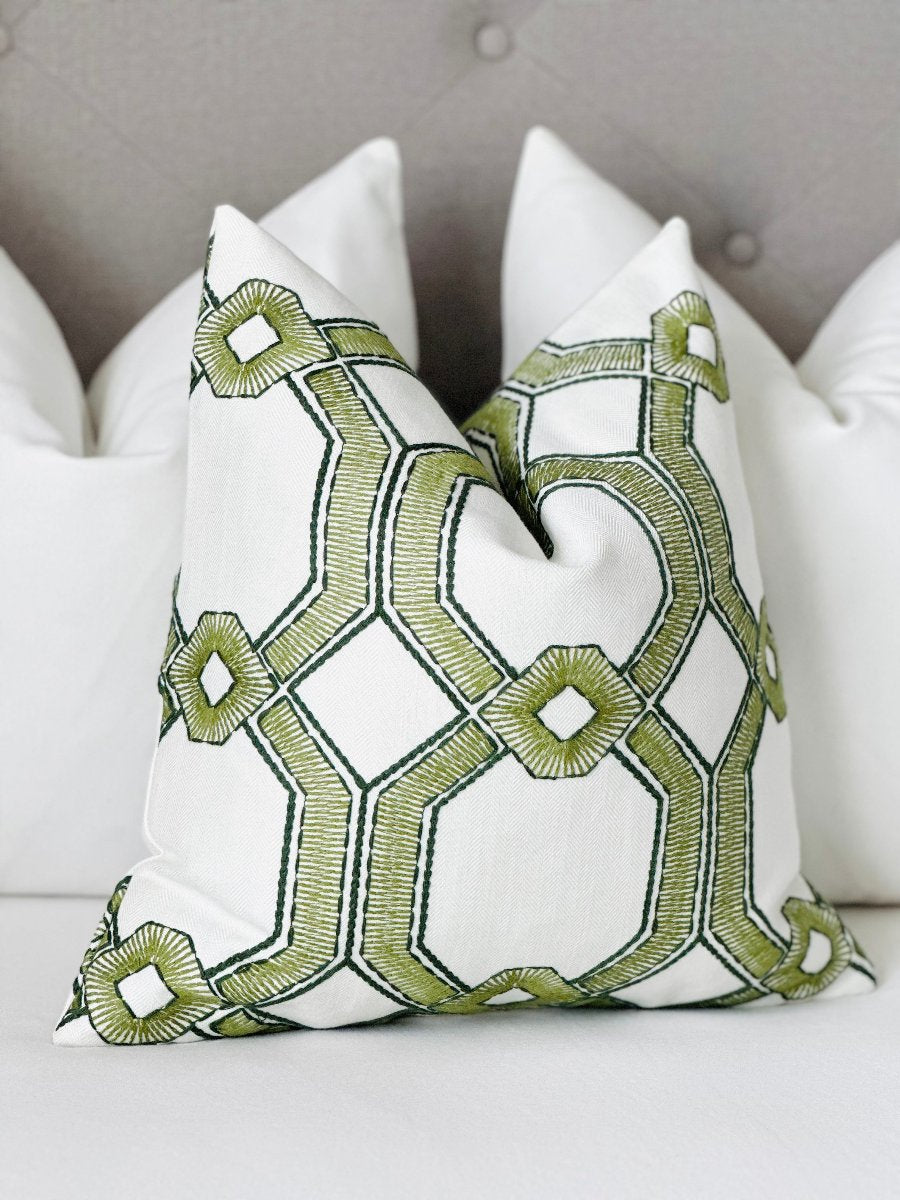 High-quality designer fabric throw pillow with exquisite green embroidery, perfect for a stylish and unique accent in any home setting