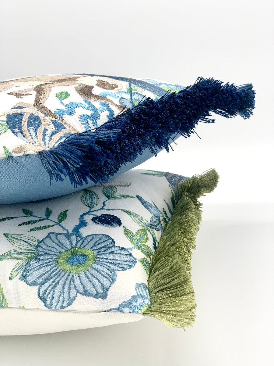 Embroidered Chinoiserie pillow with blue fringe detail