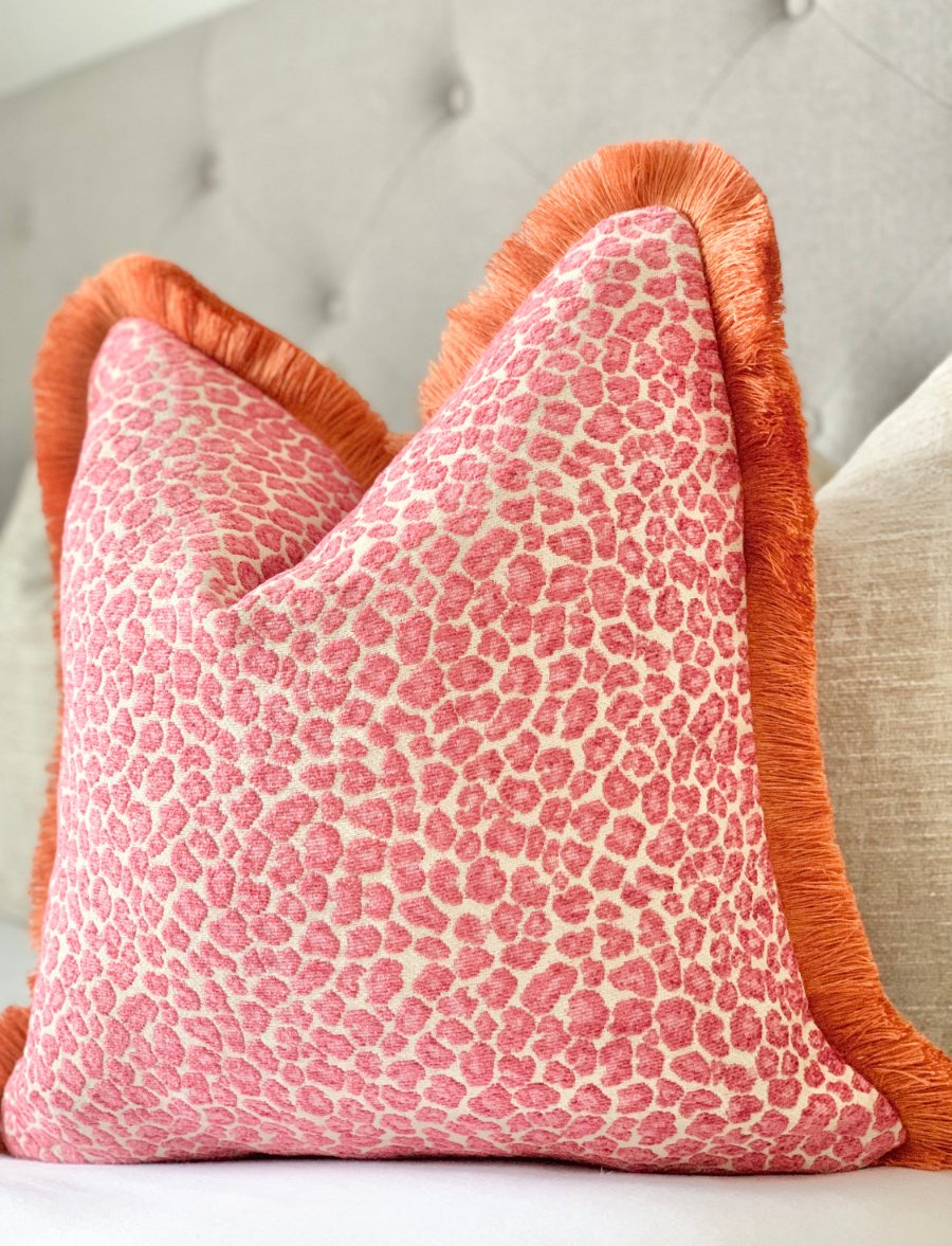 Custom pink cheetah print throw pillow with orange fringe detail - luxurious designer fabric, made-to-order accent pillow for stylish chinoiserie home decor luxurious made-to-order designer fabric accent pillow for bedroom and living room in chinoiserie style decor